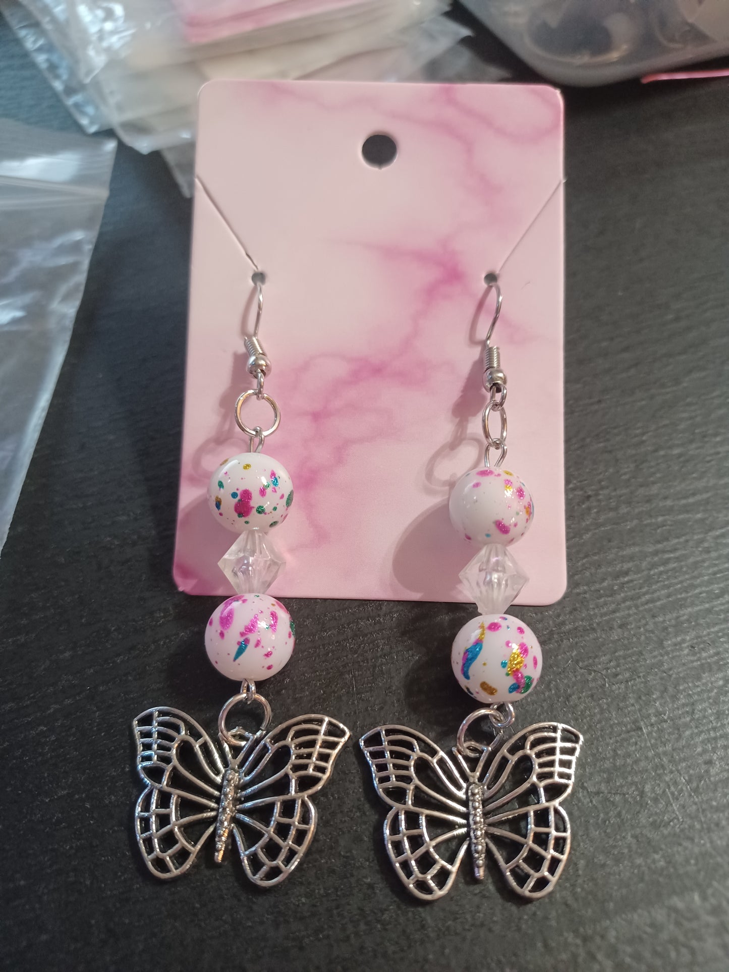 white confiti butterfly earrings